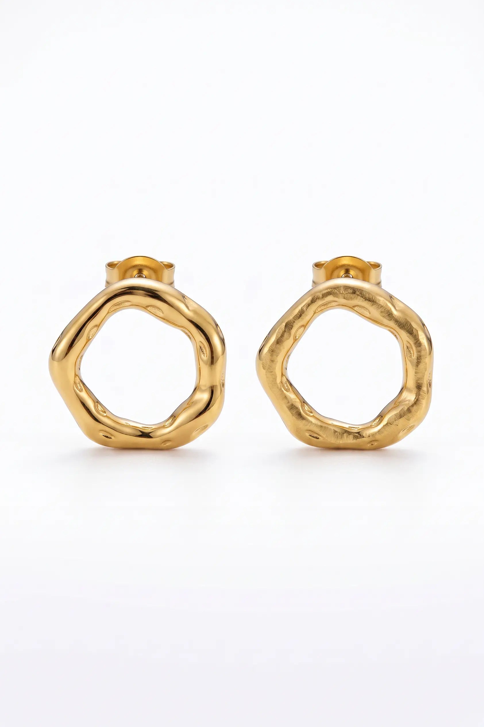 A pair of gold-toned textured ring-shaped hoop earrings on a clean white background.