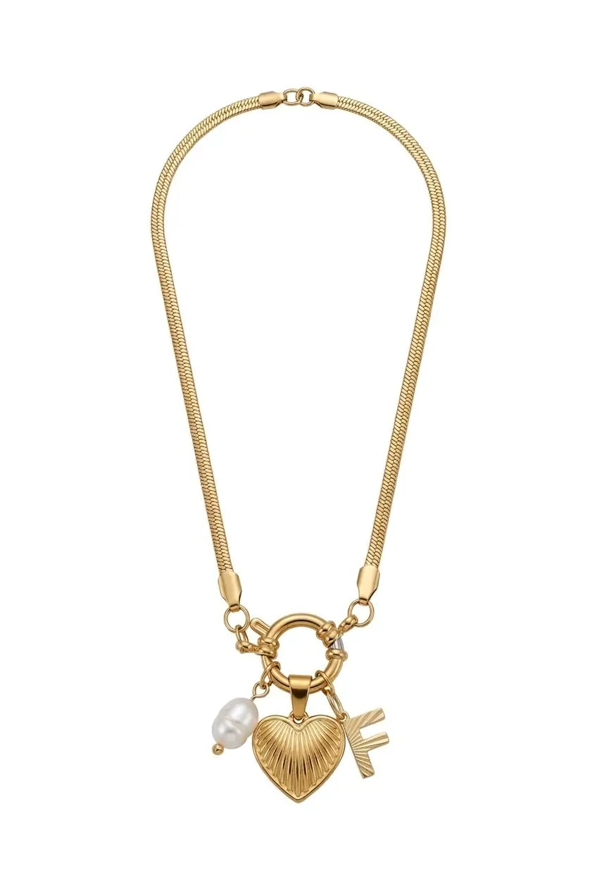 A gold-toned snake chain necklace featuring a heart-shaped charm with a textured ribbed pattern, a small white pearl bead, and a small gold key charm, displayed on a clean white background.