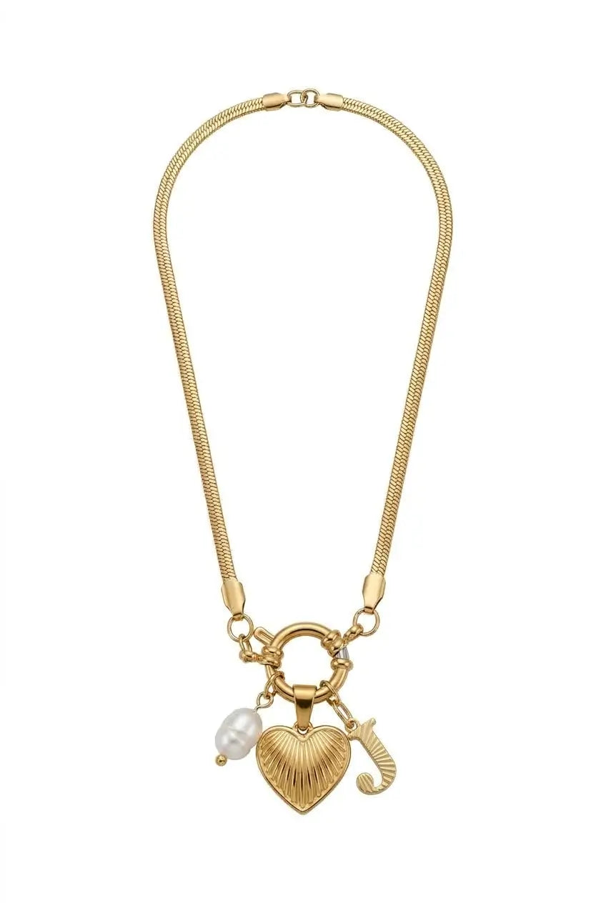 A gold-tone snake chain necklace featuring a heart-shaped charm with a textured ribbed finish, a small white pearl bead, and a gold initial 'J' charm, displayed on a clean white background.