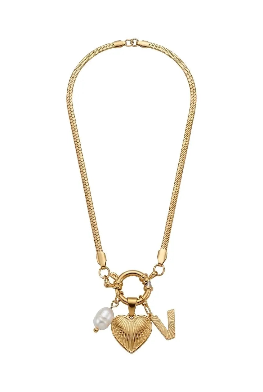 A gold-tone chain necklace featuring a heart-shaped charm with a textured finish, a small white pearl bead, and a gold 'N' initial charm, displayed on a clean white background.
