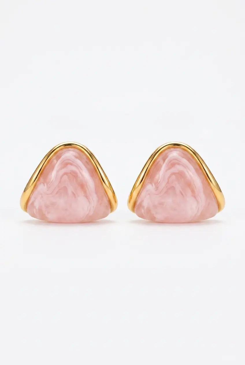 A pair of gold-tone stud earrings with triangular pink marbled stone inlays, shown against a plain white background.