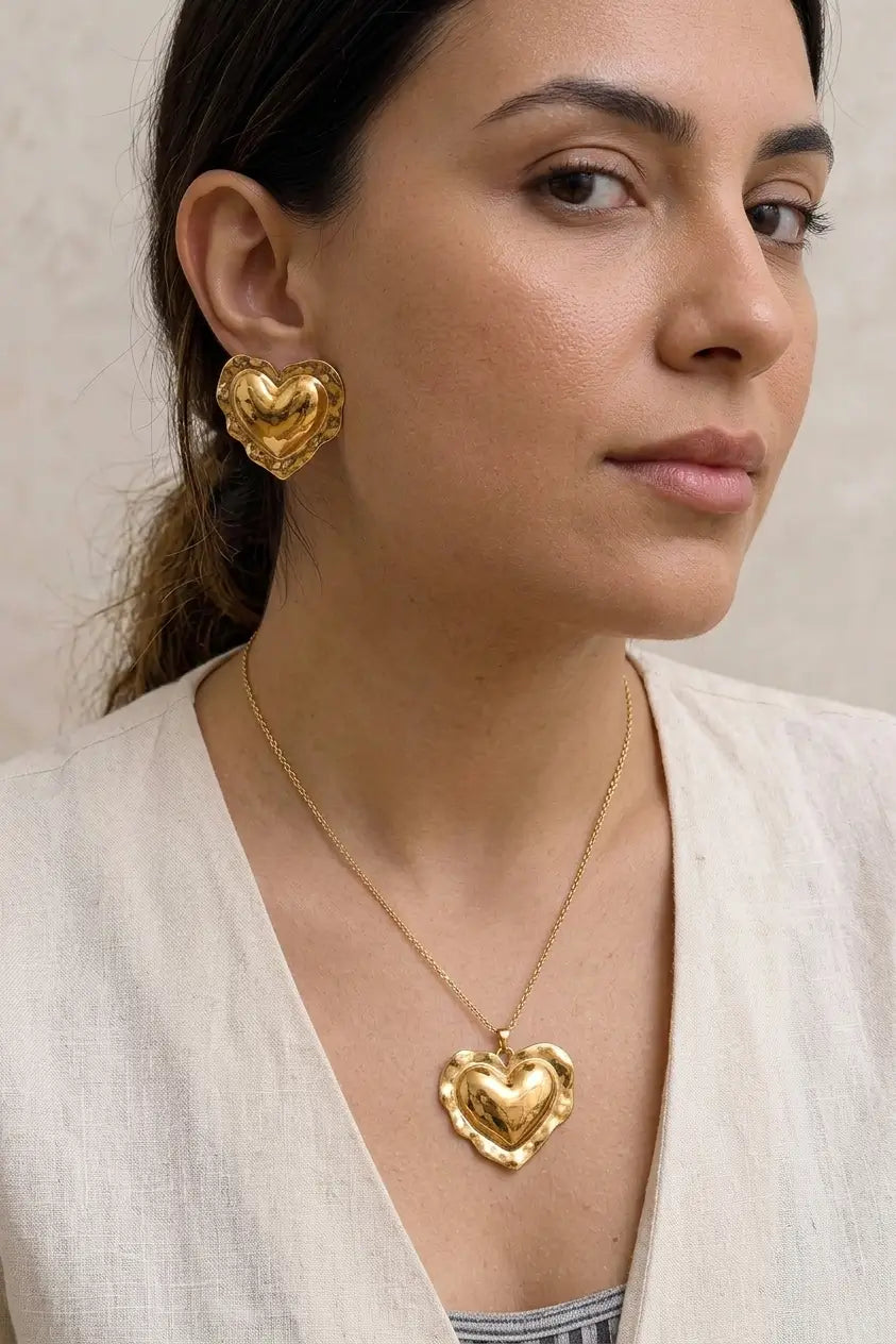 Bold hammered heart stud earrings lifestyle — YUBAMA waterproof gold heart earrings