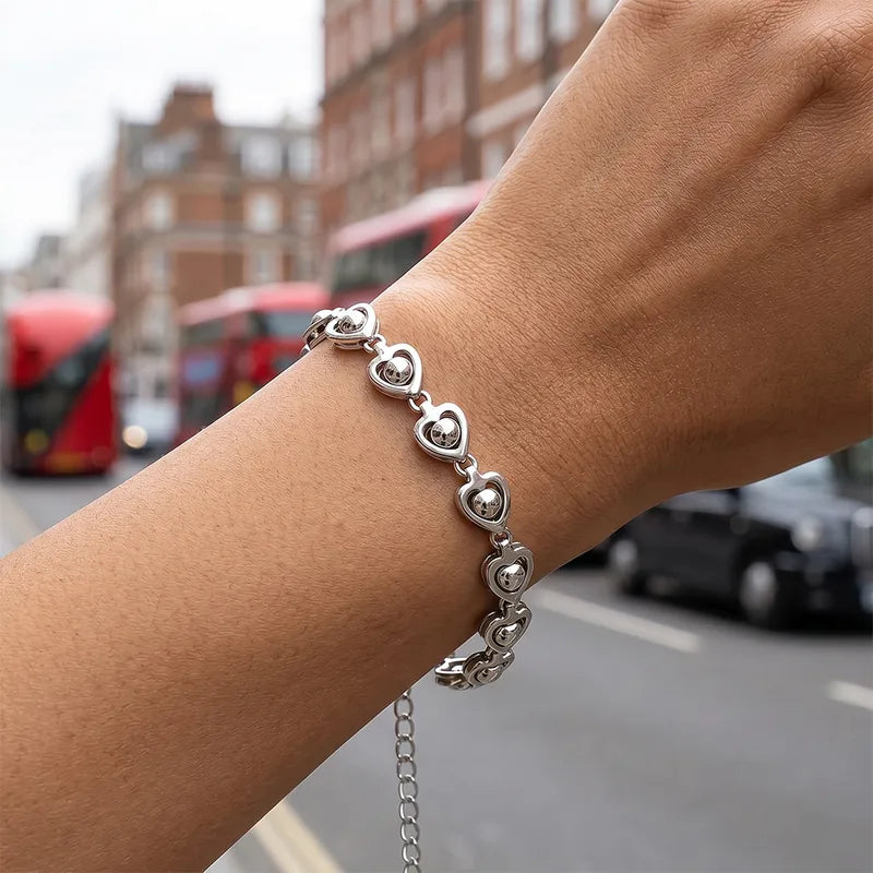 Heart link chain bracelet worn on wrist in city — YUBAMA waterproof silver bracelet