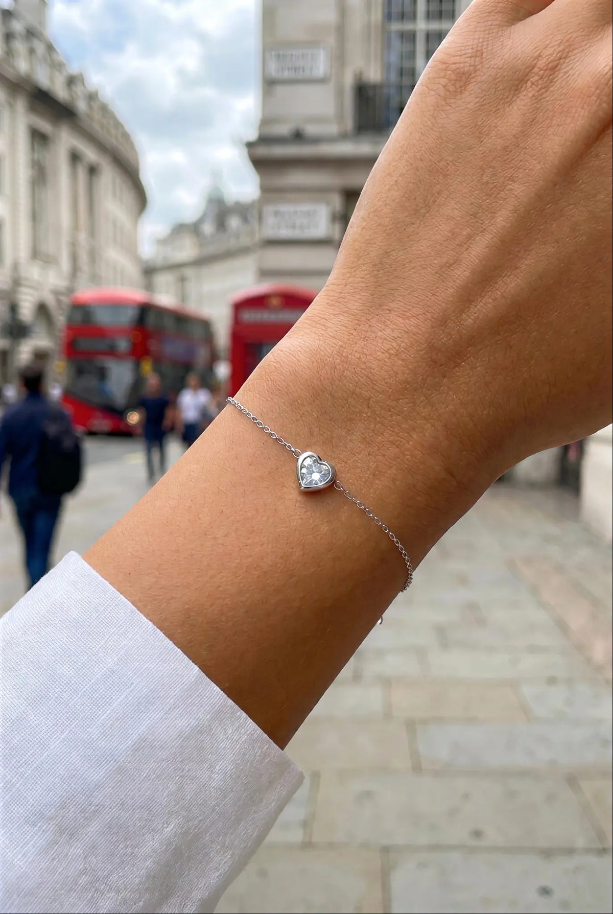 Dainty crystal heart bracelet worn on wrist — YUBAMA 18K gold PVD waterproof bracelet