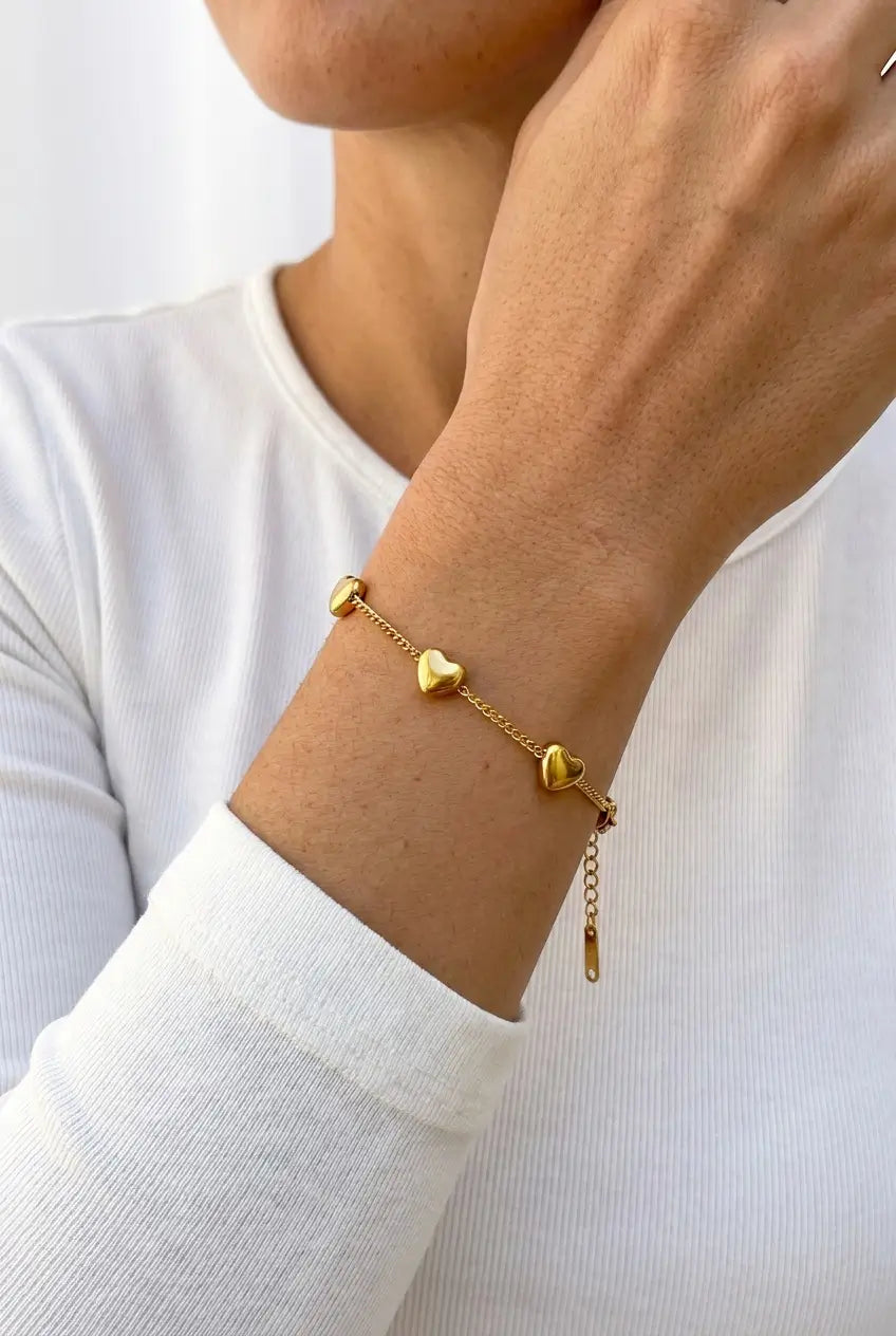 Puffy heart station bracelet lifestyle — YUBAMA waterproof gold heart bracelet