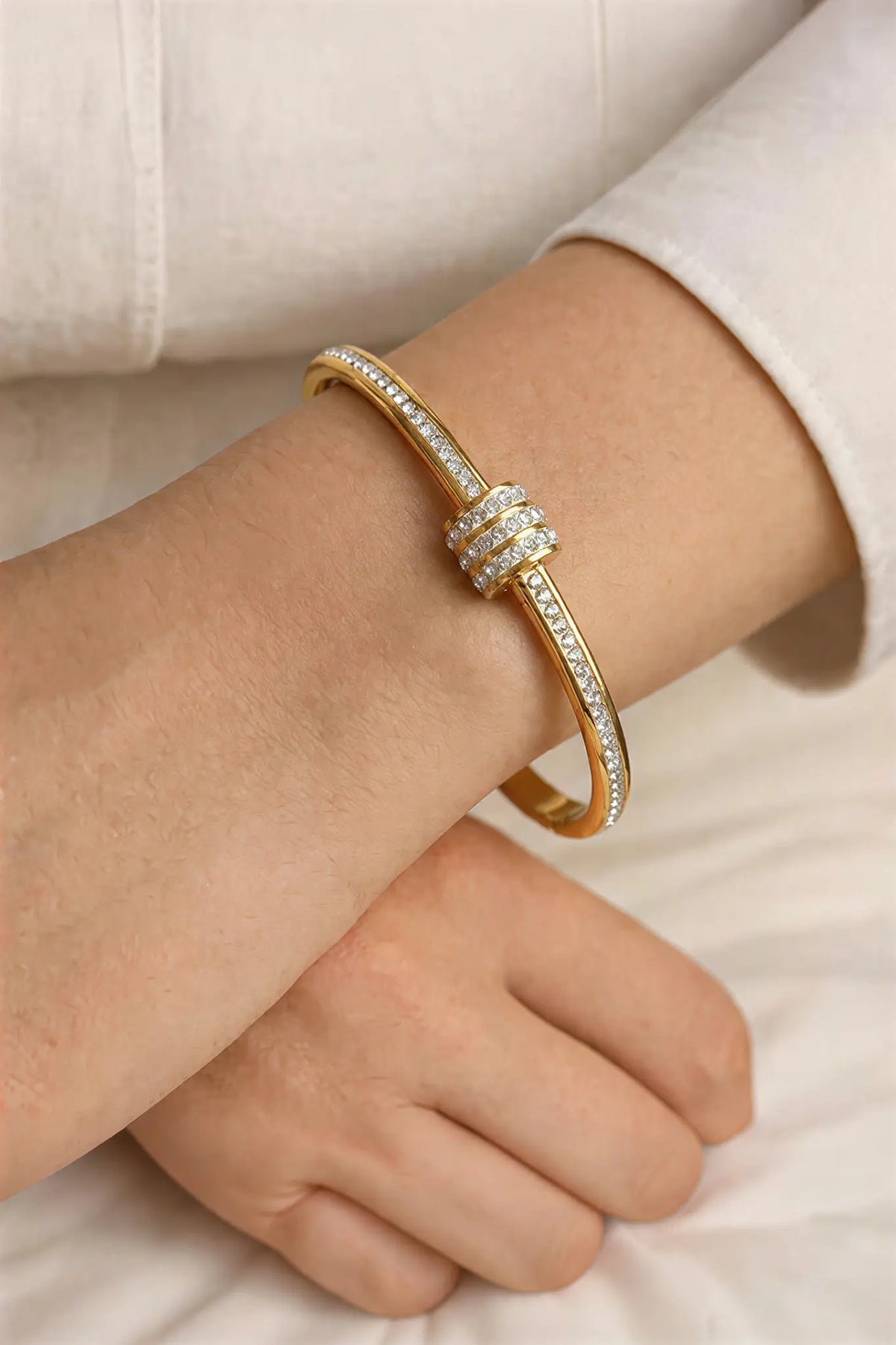 Pavé crystal nail cuff bangle worn on wrist — YUBAMA 18K gold PVD waterproof bangle