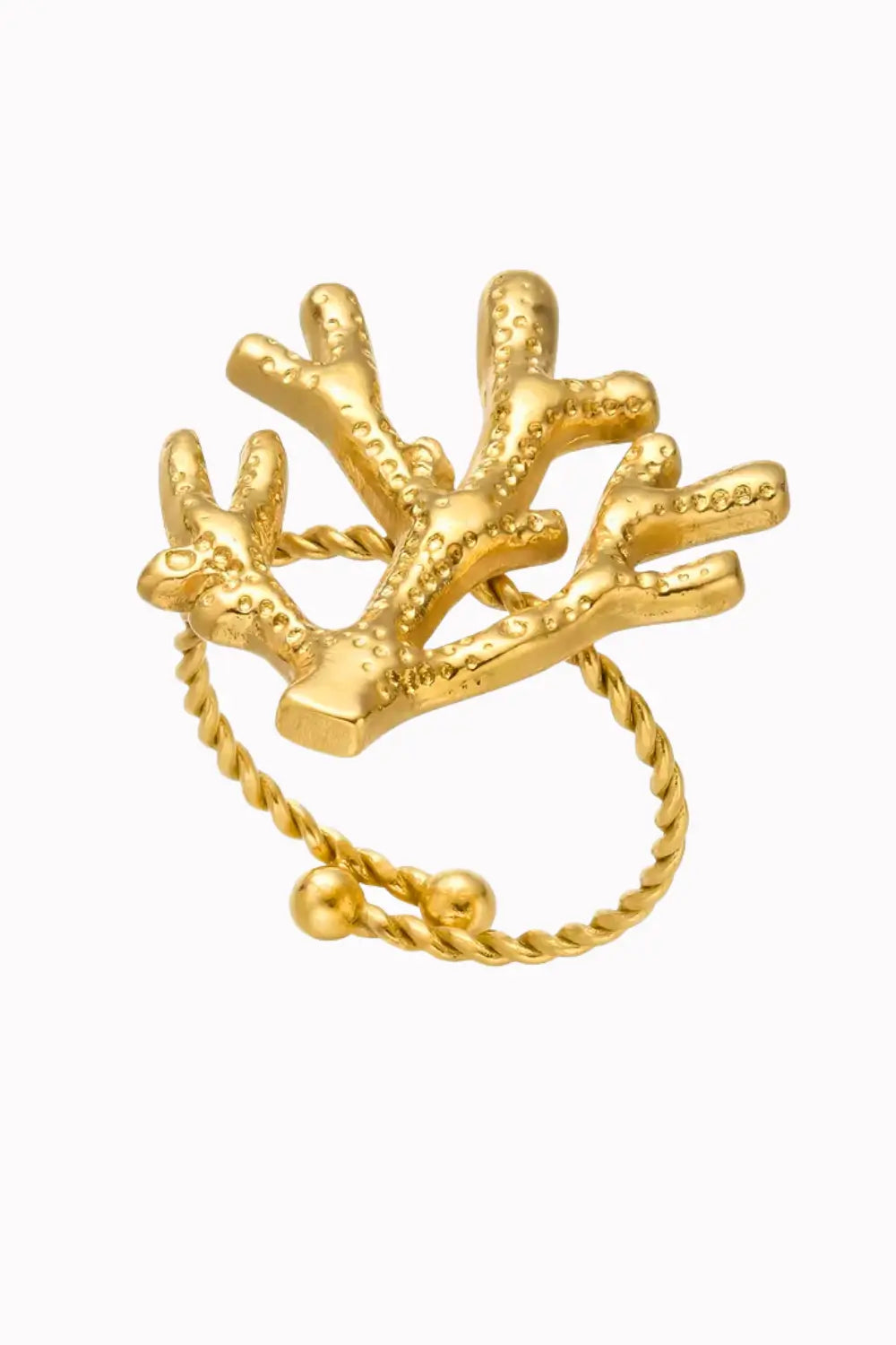 A gold coral ring with a textured, branching coral top and a twisted rope band featuring a small gold bead, shown on a plain white background.