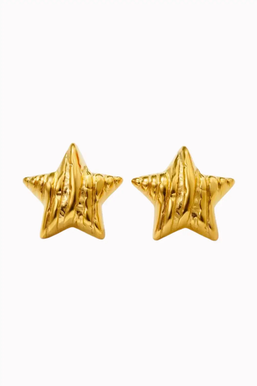 A pair of textured gold star-shaped stud earrings on a plain white background.