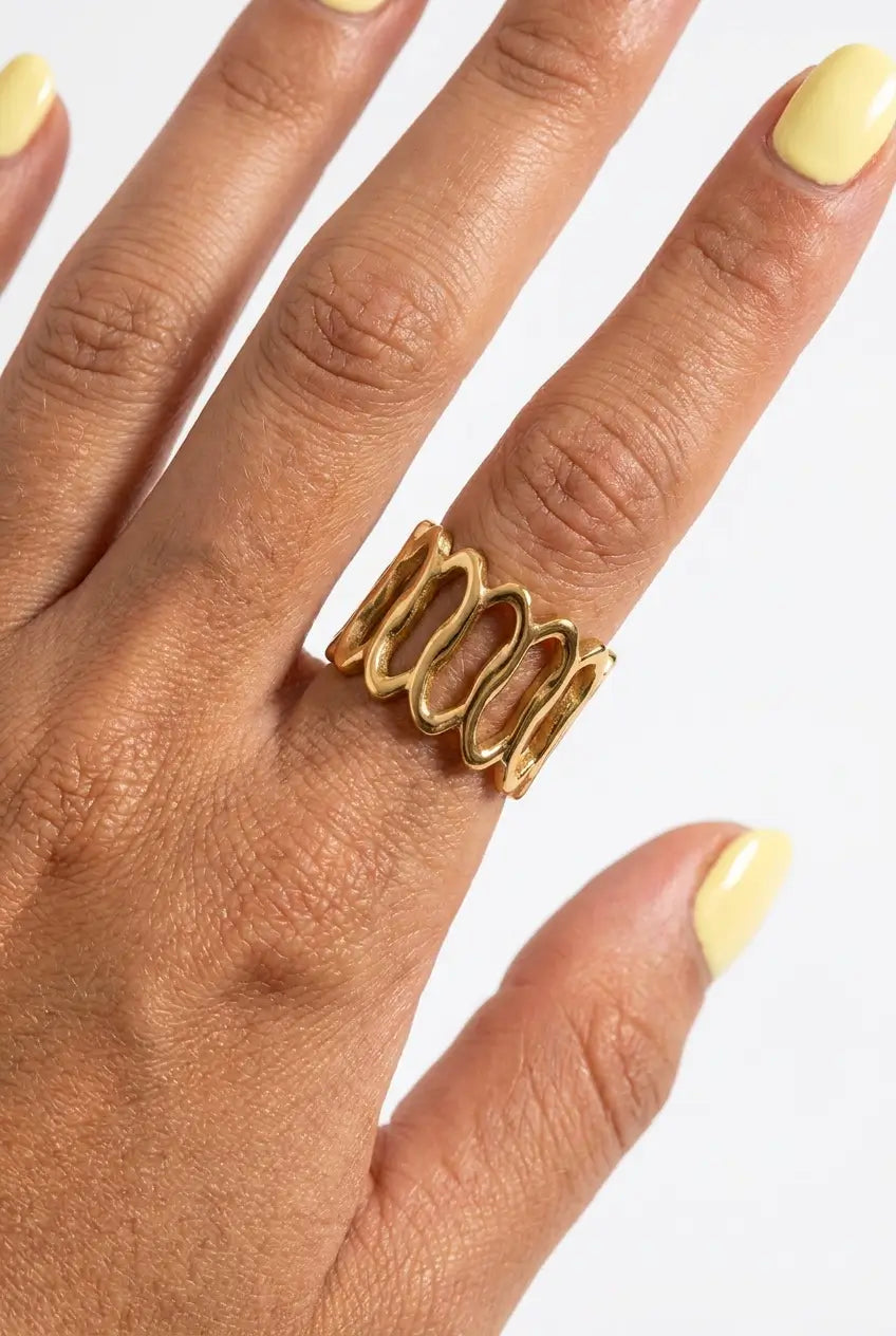 Open oval lattice ring close up on fingers — YUBAMA 18K gold PVD ring