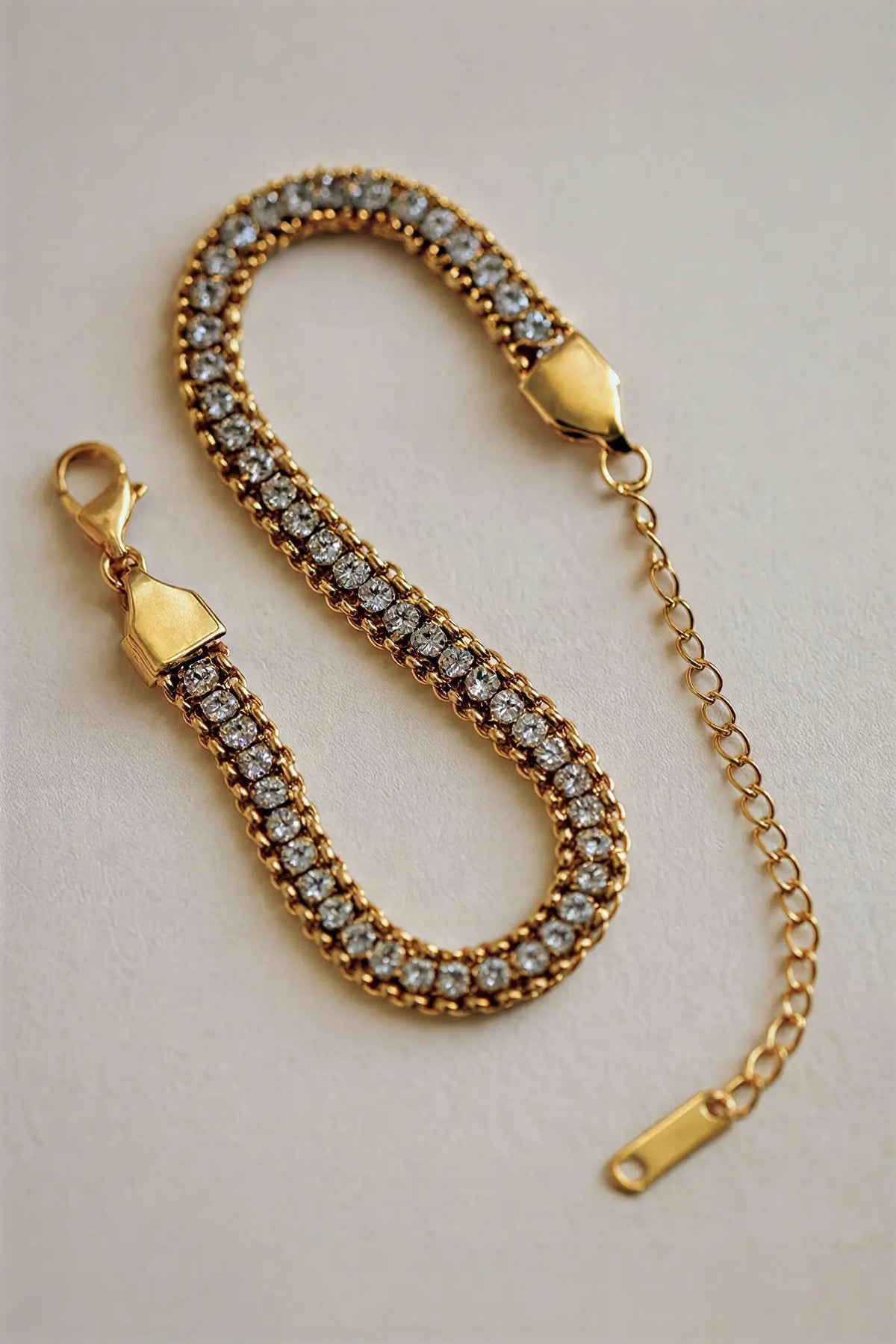 Crystal snake chain cuff bracelet flat lay — YUBAMA 18K gold PVD crystal bracelet