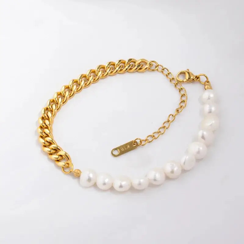 A gold chain bracelet featuring a strand of white freshwater pearls on one side, displayed on a clean white background.