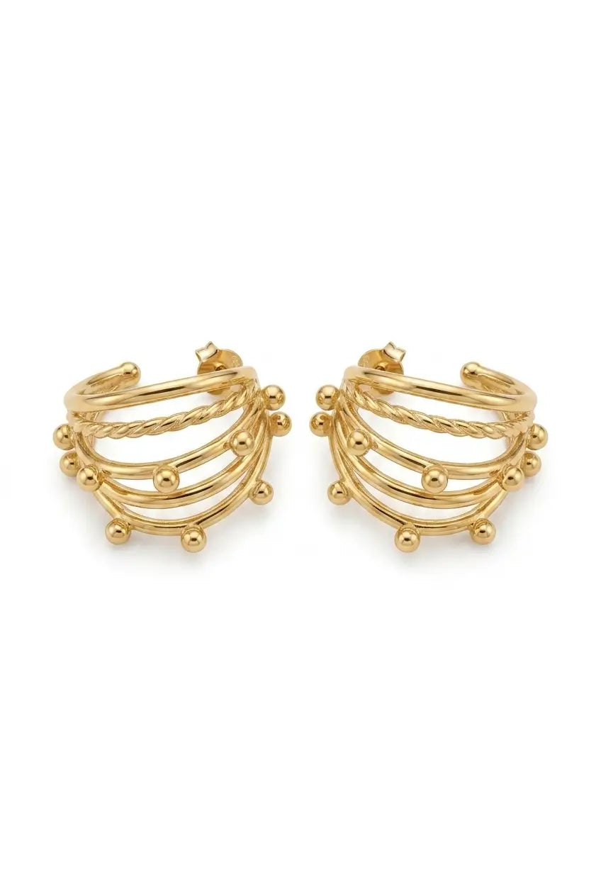 A pair of gold-toned multi-band hoop earrings with small bead accents, displayed on a clean white background.