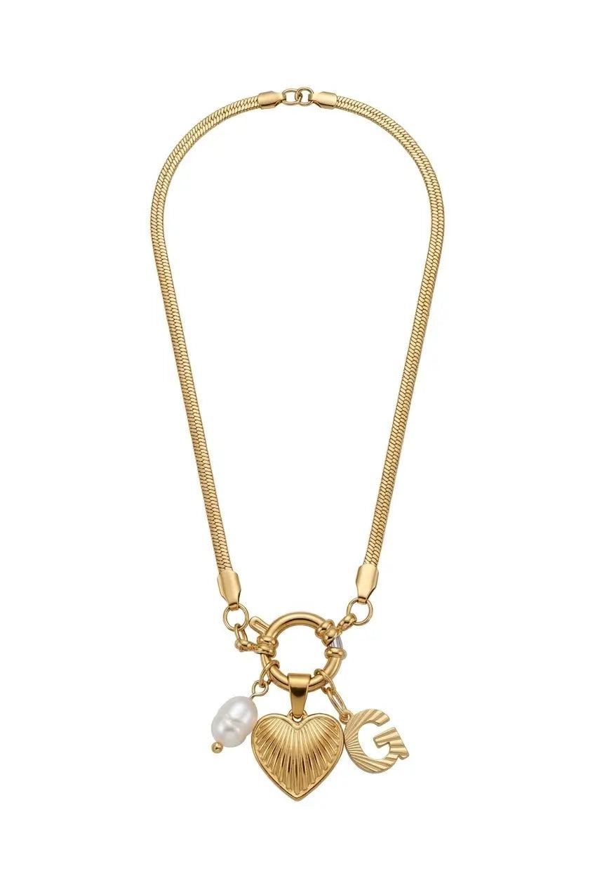 A gold-tone chain necklace featuring a heart-shaped charm with a textured finish, a small white pearl bead, and a 'G' initial charm, displayed on a clean white background.