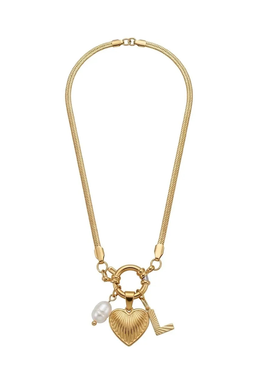A gold-tone chain necklace featuring a heart-shaped charm with a ribbed texture, a small white pearl bead, and a small gold-tone wing charm, displayed on a clean white background.