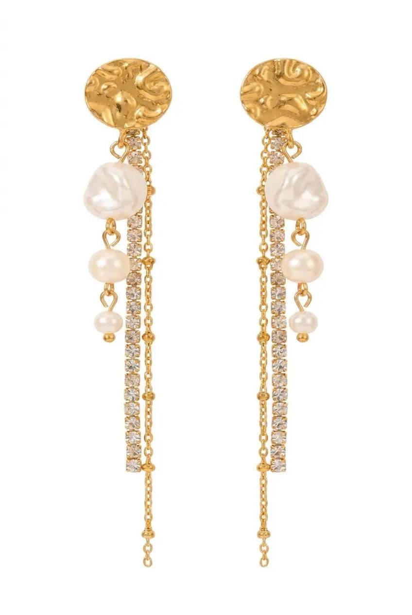 A pair of gold dangle earrings featuring textured round studs, baroque pearls, and pavé-set clear stones on a white background.