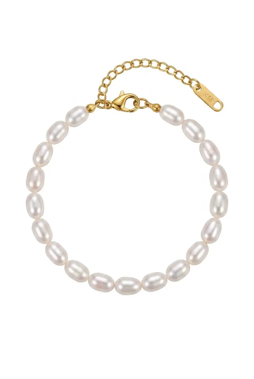 A freshwater pearl bracelet with a gold clasp and extender chain, shown on a plain white background.