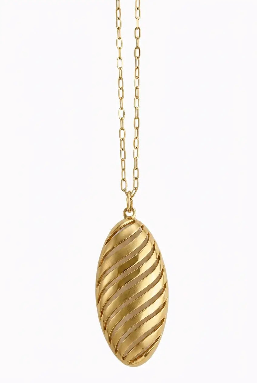 A gold pendant necklace featuring a vertically oriented, ribbed oval pendant suspended from a delicate gold chain, set against a plain white background.