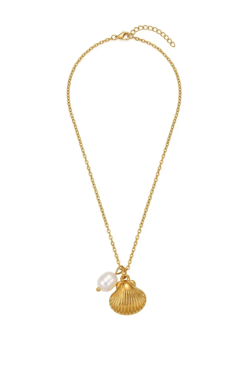 A gold chain necklace featuring a textured gold shell pendant and a small white pearl bead, displayed on a clean white background.