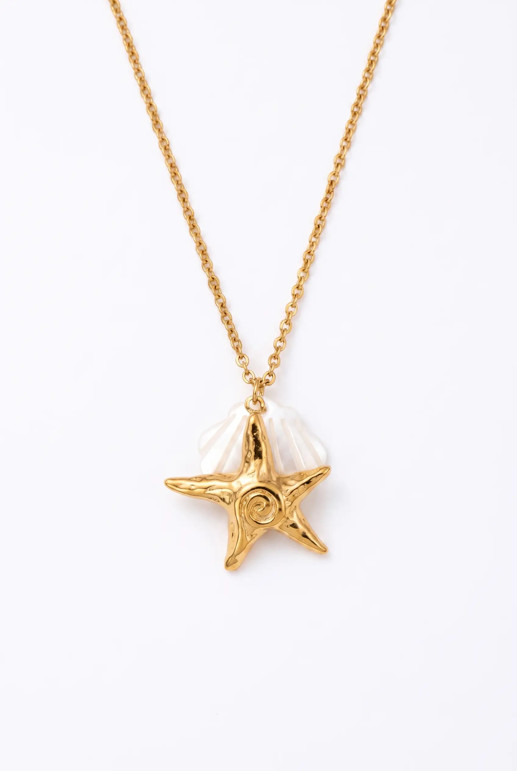 A gold chain necklace featuring a starfish pendant with a white shell detail, displayed against a clean white background.