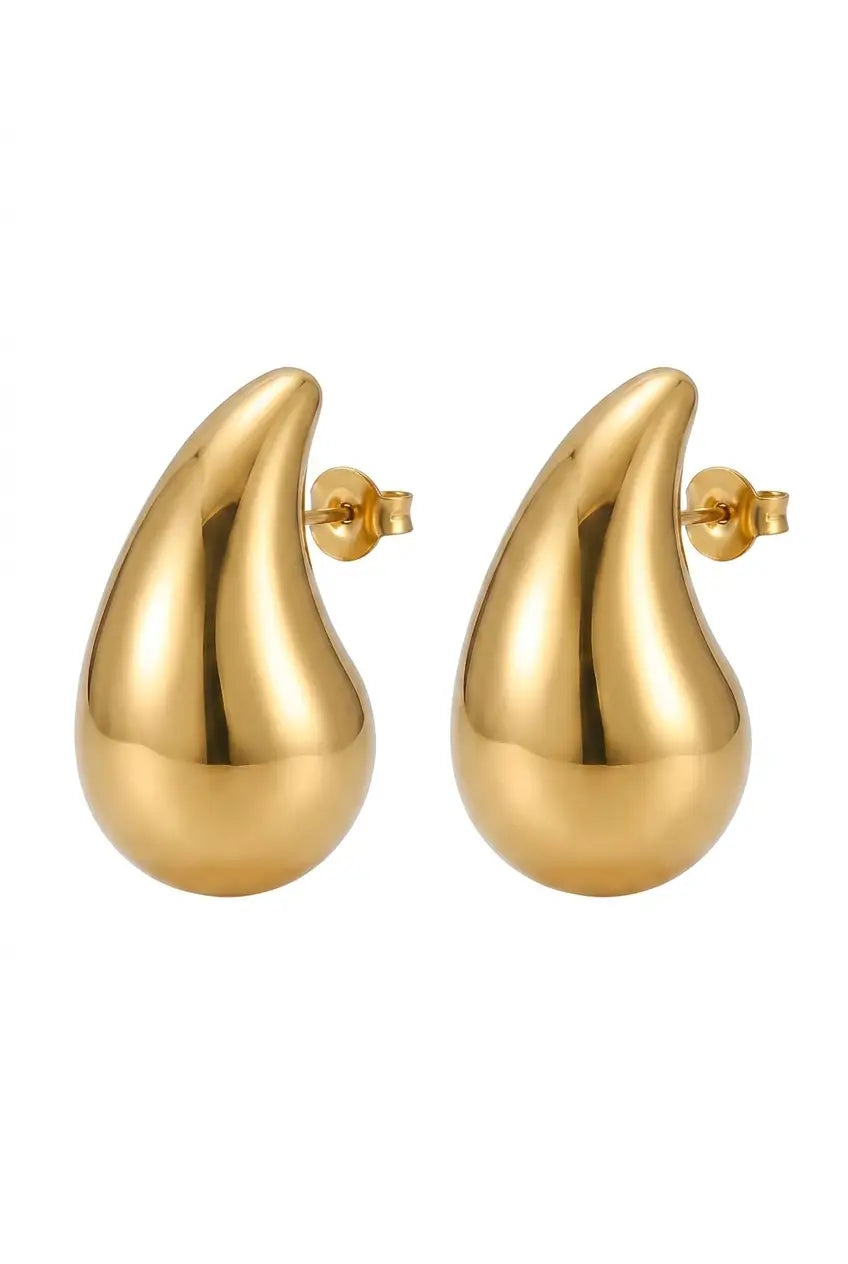 A pair of gold teardrop-shaped stud earrings with a polished, reflective finish and post backs, shown against a plain white background.