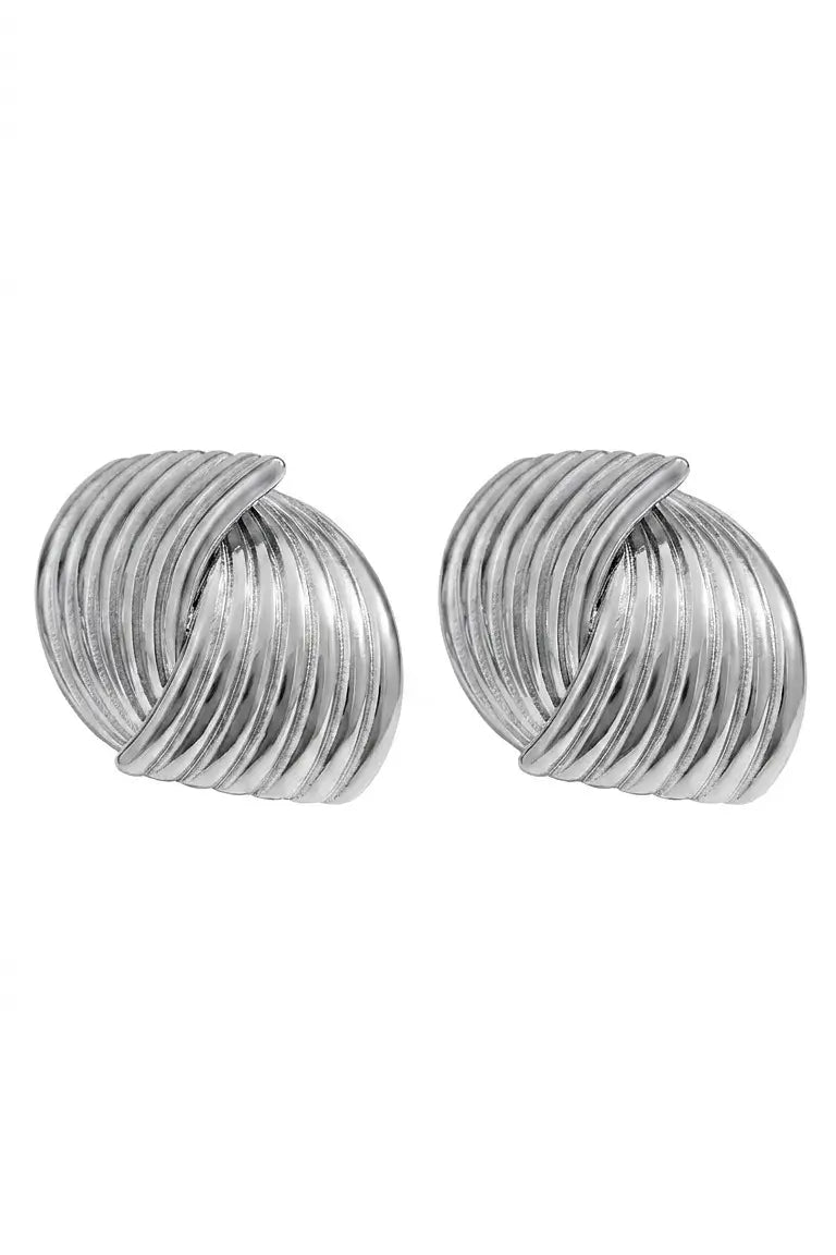 A pair of silver-toned twisted spiral hoop earrings on a plain white background.