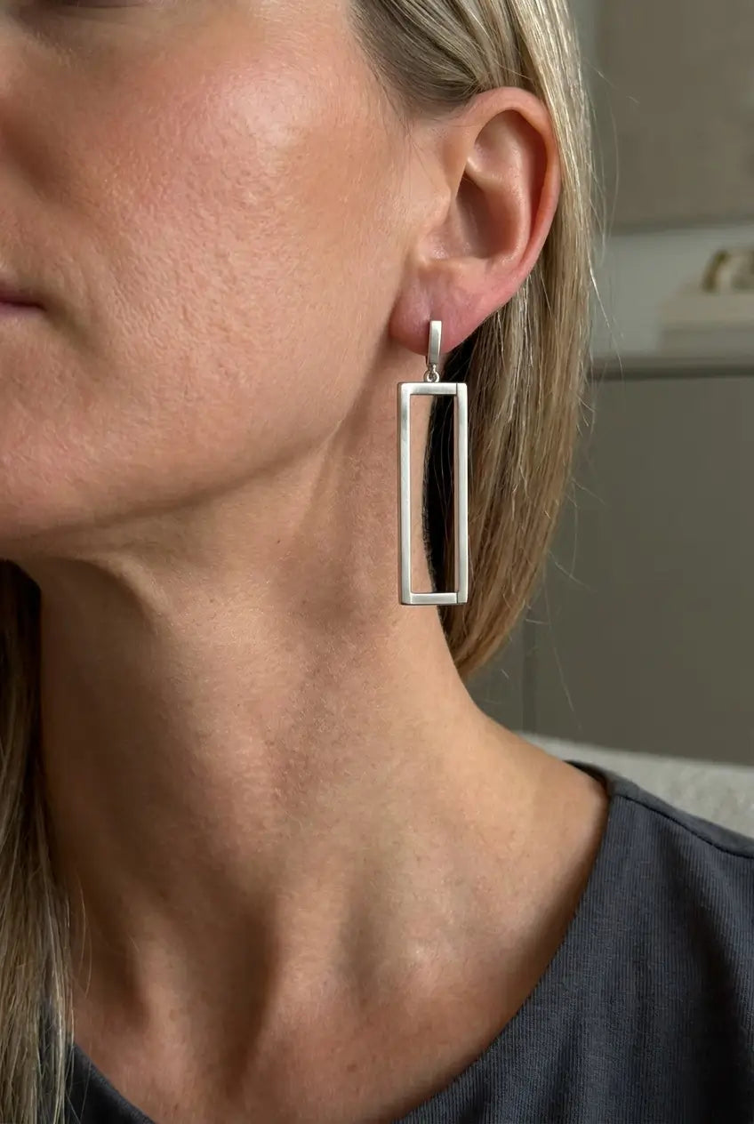 Open rectangle drop earrings silver worn on ear — YUBAMA waterproof geometric earrings