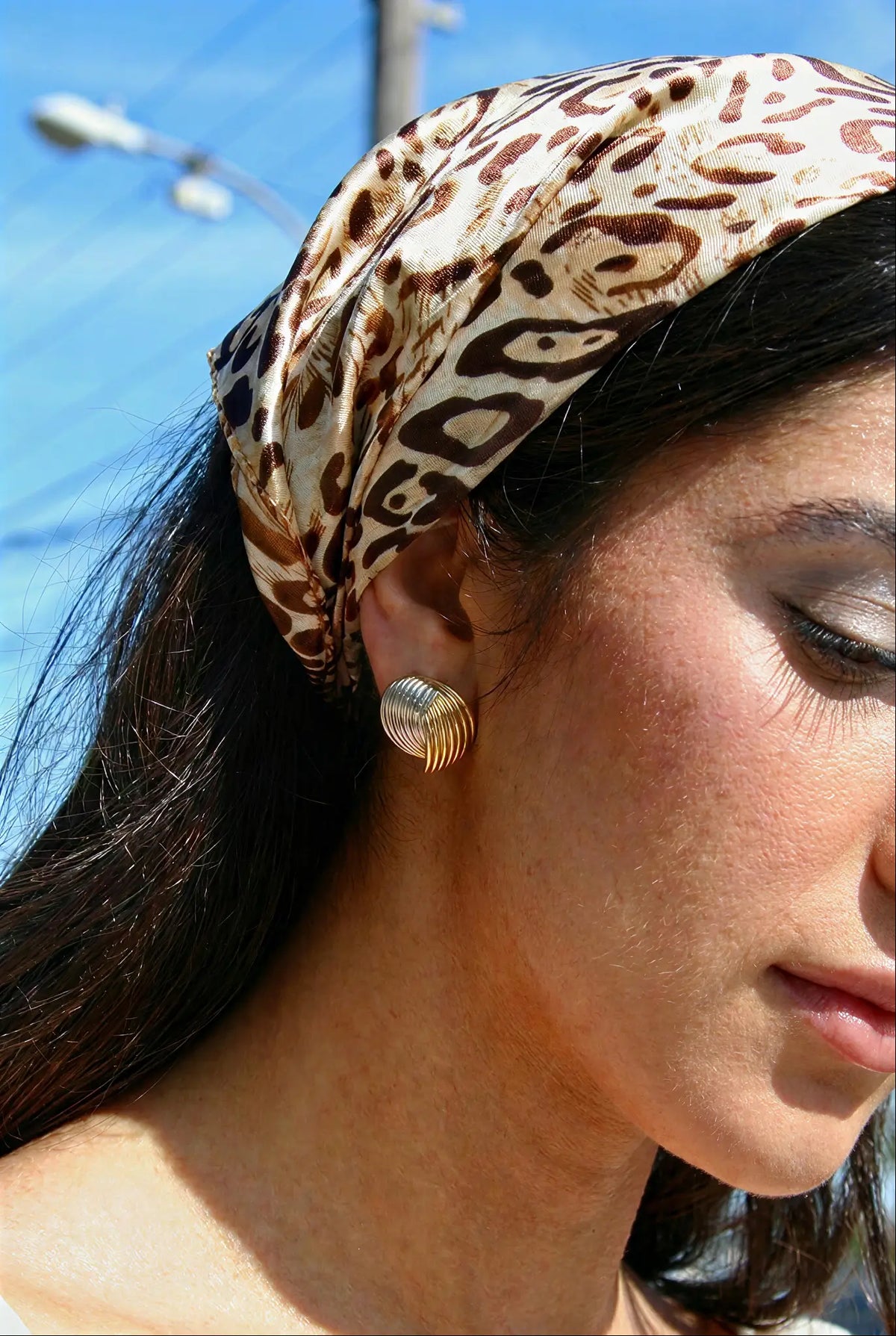 Two-tone wire coil stud earrings lifestyle — YUBAMA waterproof sculptural stud earrings