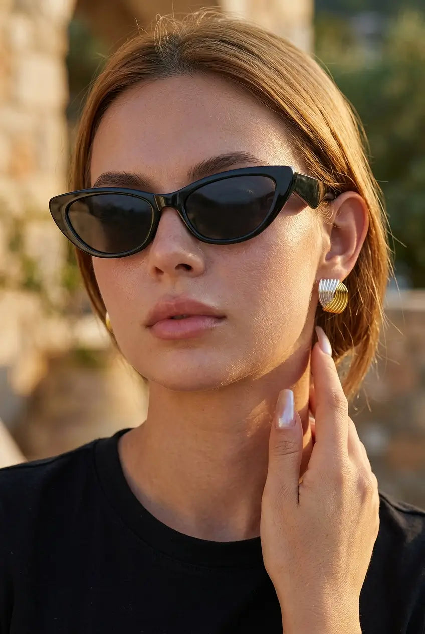 Two-tone wire coil stud earrings outdoor lifestyle — YUBAMA 18K gold PVD earrings