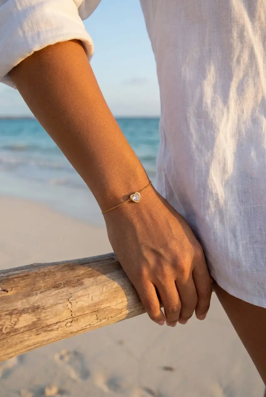 Dainty crystal heart bracelet worn at beach — YUBAMA waterproof gold bracelet
