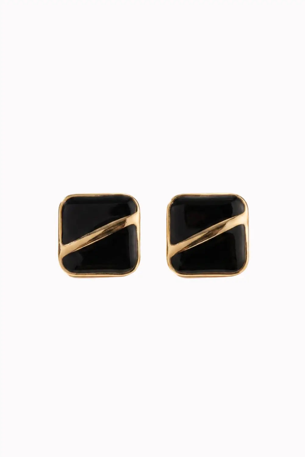 A pair of square stud earrings with a glossy black face and a diagonal gold metal stripe, set against a plain white background.