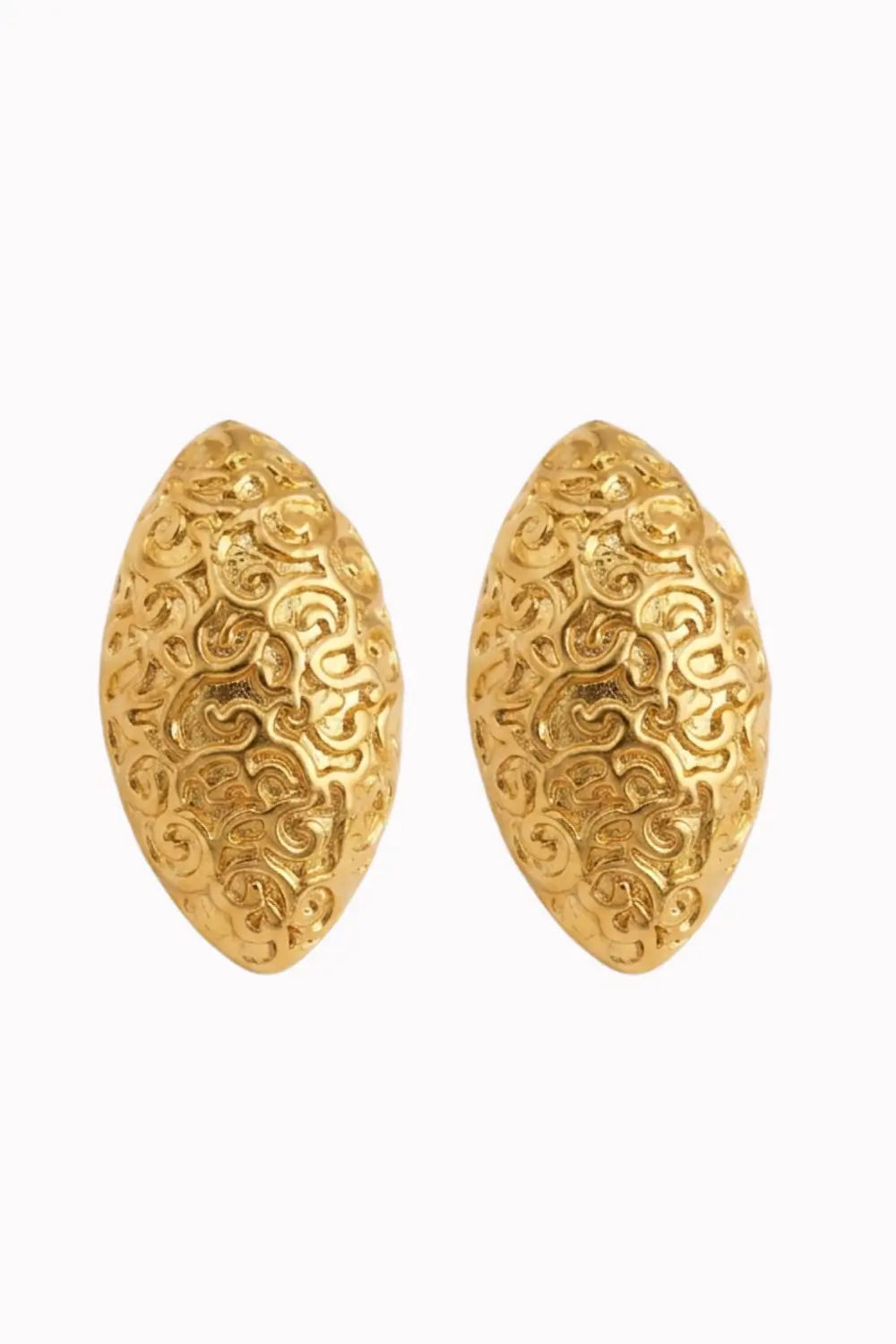 A pair of gold-toned oval stud earrings with an intricate, raised scrollwork pattern, shown against a plain white background.